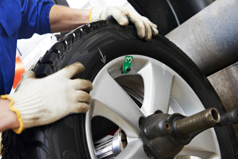 close up of car wheel tyre fitting service